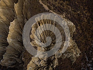 Aerial top down view of Omarama Clay Cliffs geological erosion silt and sand rock formation in Canterbury New Zealand