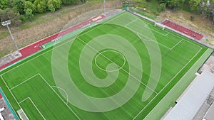 Aerial top down view over an empty soccer field. Stadium. Green court arena.