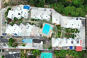 Aerial top down view of a resort with white buildings