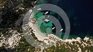 Aerial top down view of rich yacht sailing sea.