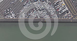 Aerial top down view on a RoRo terminal, which is short for roll on roll off terminal. Transport of rolling vehicles