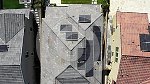 Aerial Top Down View Solar Panels on Rooftops in Residential Area, energy
