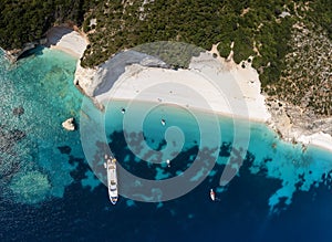 Aerial top down view to the beautiful and secluded Fteri beach photo