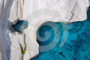 Aerial top down view to the chalk rock formations of Sarakiniko, Milos island, Cyclades, Greece