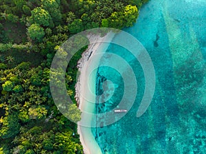 Aerial top down view tropical paradise pristine beach rainforest blue lagoon at Banda Island, Pulau Ay. Indonesia Moluccas