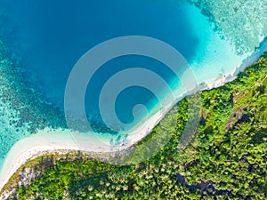 Aerial top down view tropical paradise pristine beach rainforest blue lagoon bay coral reef caribbean sea turquoise water at