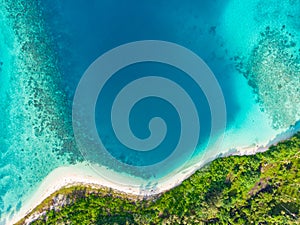 Aerial top down view tropical paradise pristine beach rainforest blue lagoon bay coral reef caribbean sea turquoise water at