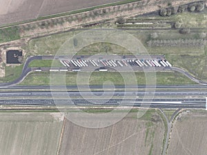 Aerial top down view on truck parking along the road, resting for lorry and road transportation logistics. Highway