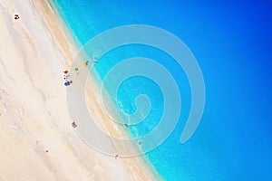 Aerial top down view of the turquoise sea of Myrtos beach, Kefalonia, Greece
