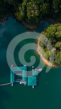 Aerial top down view of water chalet resort in Kenyir Lake, Terengganu, Malaysia