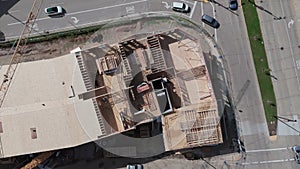 Aerial top down wide view of frames and foundations of houses under construction