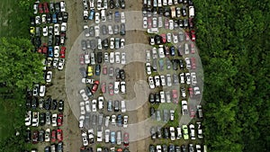 Aerial top shot abandoned, destroyed cars in junkyard. Car recycling industry