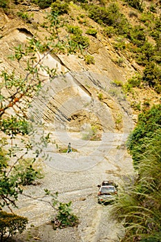 Aerial top view 4WD on river valley gorge off-road in wild springtime nature on adventure extreme tour in VAshlovani national park