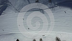 Aerial top view of alpine skiing downhil piste