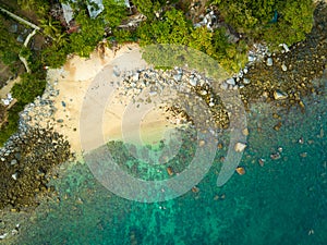 aerial top view Ao Sean small white sand beach lined with rocks.