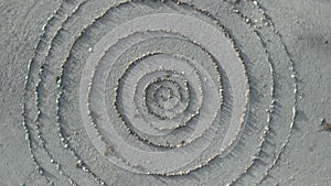 Aerial top view and approximation of a spiral stone path labyrinth