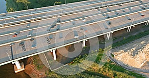 Aerial top view automobile Alfred E. Driscoll Bridge across the Raritan River in the connected town of Woodbridge and
