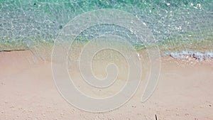 Aerial top view of beautiful tropical white sand beach with wave foam and transparent sea, Summer vacation and Travel background