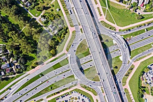 Aerial top view of big city roundabout traffic