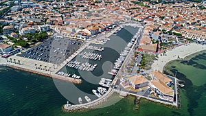 Aerial top view of boats and yachts in marina from above, harbor of Meze town, France