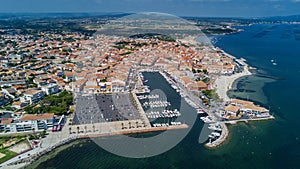 Aerial top view of boats and yachts in marina from above, harbor of Meze town, France