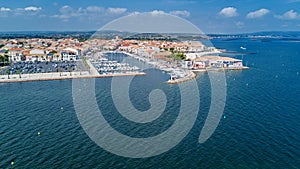 Aerial top view of boats and yachts in marina from above, harbor of Meze town, France