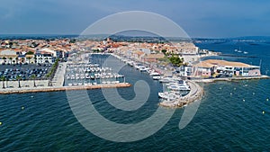 Aerial top view of boats and yachts in marina from above, harbor of Meze town, France