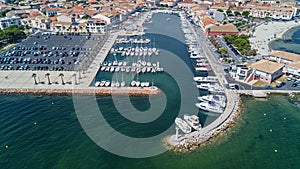 Aerial top view of boats and yachts in marina from above, harbor of Meze town, France