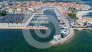 Aerial top view of boats and yachts in marina from above, harbor of Meze town, South France