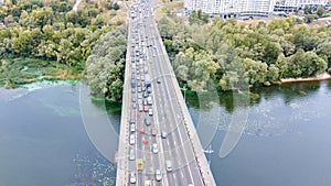 Aerial top view of bridge road automobile traffic jam of many cars from above, block and road repair, city transportation