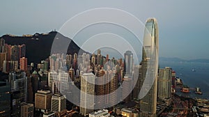 AERIAL. Top view of buildings in Hong Kong city at sunset.