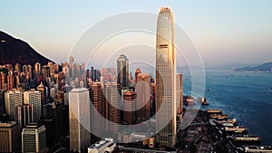 AERIAL. Top view of buildings in Hong Kong city at sunset.