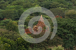 Aerial top view of burmese temples of Bagan City from a balloon, unesco world heritage with forest trees, Myanmar or Burma.