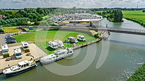 Aerial top view of camping and marina with boats in harbour from above, North Holland, Netherlands