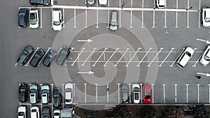 Aerial top view of car parking near business center with parked automobiles business class. Drone flying above cars parking