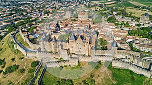 Aerial top view of Carcassonne medieval city and fortress castle from above, France