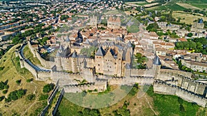 Aerial top view of Carcassonne medieval city and fortress castle from above, France