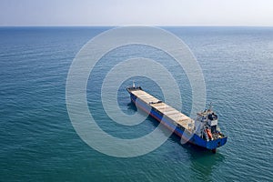 Aerial top view of cargo ship vessel import-export sailing