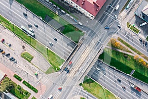 Aerial top view of city road intersection with traffic bridge