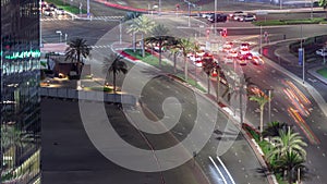 Aerial top view of city traffic on a crossroad in Dubai Business bay night timelapse.