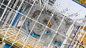 Aerial top view construction site with industrial machinery building for new  factory buildings