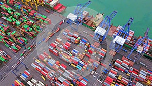 Aerial top view of container cargo ship in the export and import business and logistics international goods in urban city.