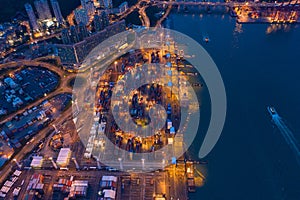 Aerial top view of container cargo ship in the export and import business and logistics international goods in urban city.