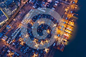 Aerial top view of container cargo ship in the export and import business and logistics international goods in urban city.