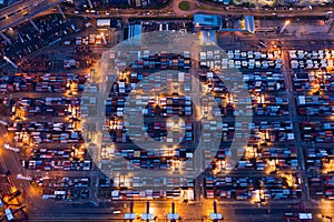 Aerial top view of container cargo ship in the export and import business and logistics international goods in urban city.