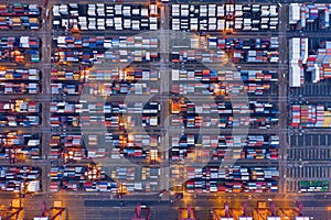 Aerial top view of container cargo ship in the export and import business and logistics international goods in urban city.