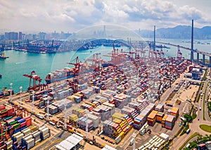 Aerial top view of container cargo ship in the export and import business and logistics international goods in urban city.