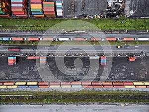 Aerial top view container in port warehouse waiting for export .