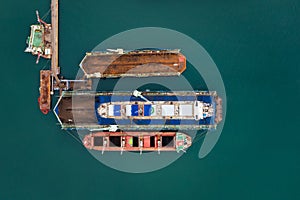Aerial top view container ship in shipyard for repair maintenance