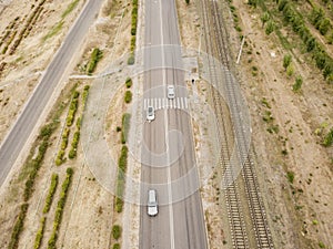 Aerial top view of crosswalk on a countryside fast speed road f